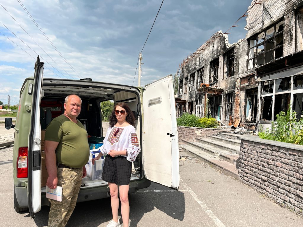 Elvira Dmitrieva of Sunflower Scotnald hands over the frontline ambulance to medics of the 151st Battalion Ukraine TRO in Tsirkuny, Kharkiv Oblast'