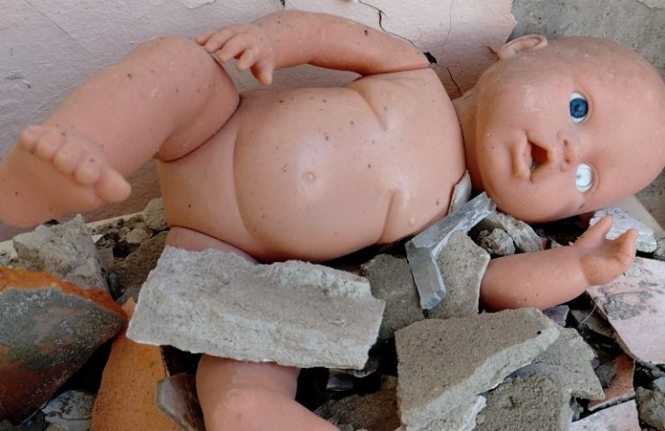 Doll under rubble in ruined nursery North Saltyvka, Kharkiv. Photo by Oleg Dmitriev