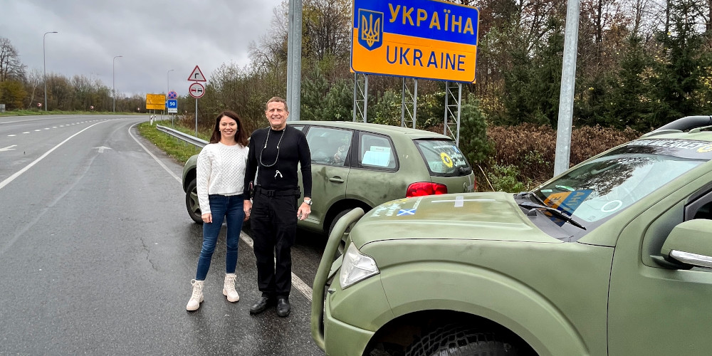 Elvira Dmitrieva (Sunflower Scotland) and Mark MacCarley delivering jeeps to Ukraine