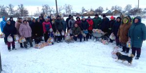 People receiving humanitarian aid from Sunflower Scotland in the village of Lozova
