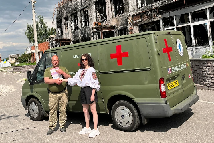 Elvira Dmitrieva of Sunflower Scotnald hands over the frontline ambulance to medics of the 151st Battalion Ukraine TRO