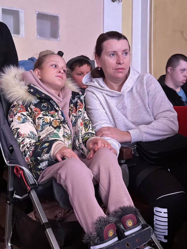 Disabled Ukrainian girl in wheelchair at a concert organised by charities Sunflower Scotland (UK) and Shira Sprava (Ukraine) in Kryvyi Rih