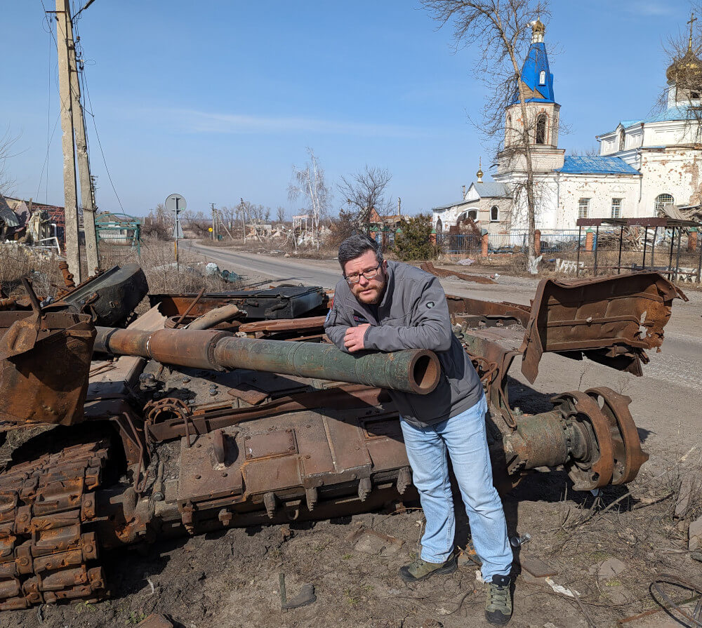 Oleg Dmitriev near the blown up tank gun in Torske, Ukraine's Lyman front line