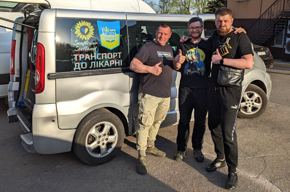 Oleg Dmitriev, chairman of Sunflower Scotland, transfers Renault Trafic van to Dmytro and Denis of Schira Sprava charity in Kryvyi Rih, Ukraine  