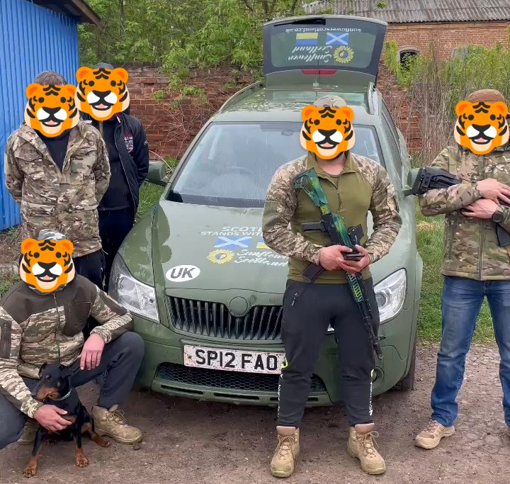 Soldiers of 129th brigade TRO thank Sunflower Scotland for delivery of Skoda Scout car