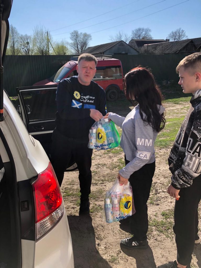 Volunteer Vitaliy Grigorov, Sunflower Scotland, distributing humanitarian aid from his car to foster families in Krasnokutsk, 06 April 2024