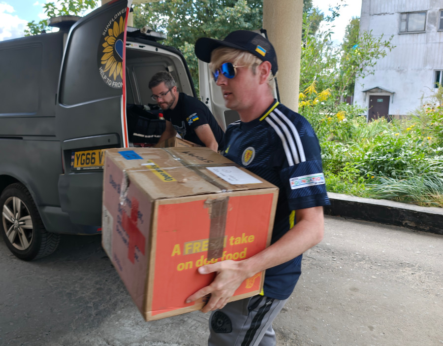 Stevie Blythe, Sunflower's volunteer, unloading medical aid at a hospital in Sumy