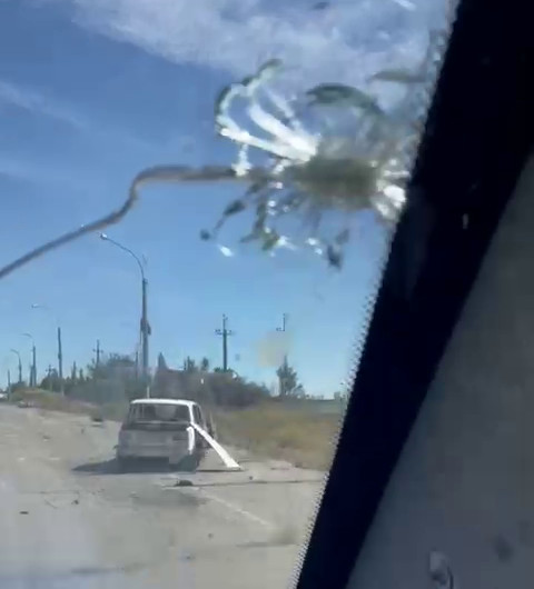 Kherson - burnt can on the road