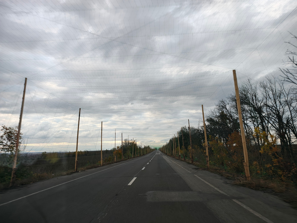 Anti-drone nets protecting cars from drones, road Slovyansk - Izium