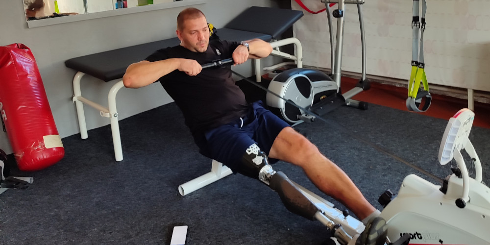 Ukrainian Paralympian Oleksandr Andriienko training on rowing machine from Scotland