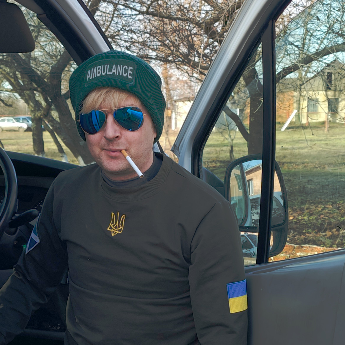 Stevie Blythe, Sunflower Scotland's volunteer, wearing Scottish ambulance hat while on a humanitarian mission in Vovchansk district