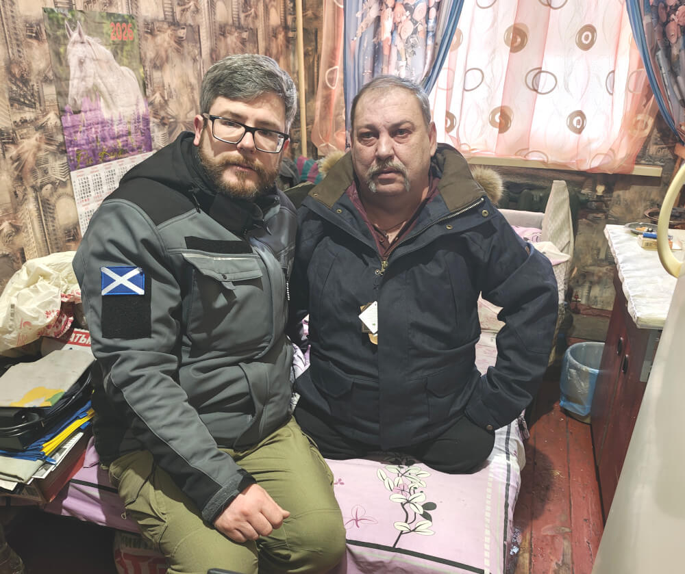 Disabled person without legs in Sumy region receiving jacket from Hoggs of Fife