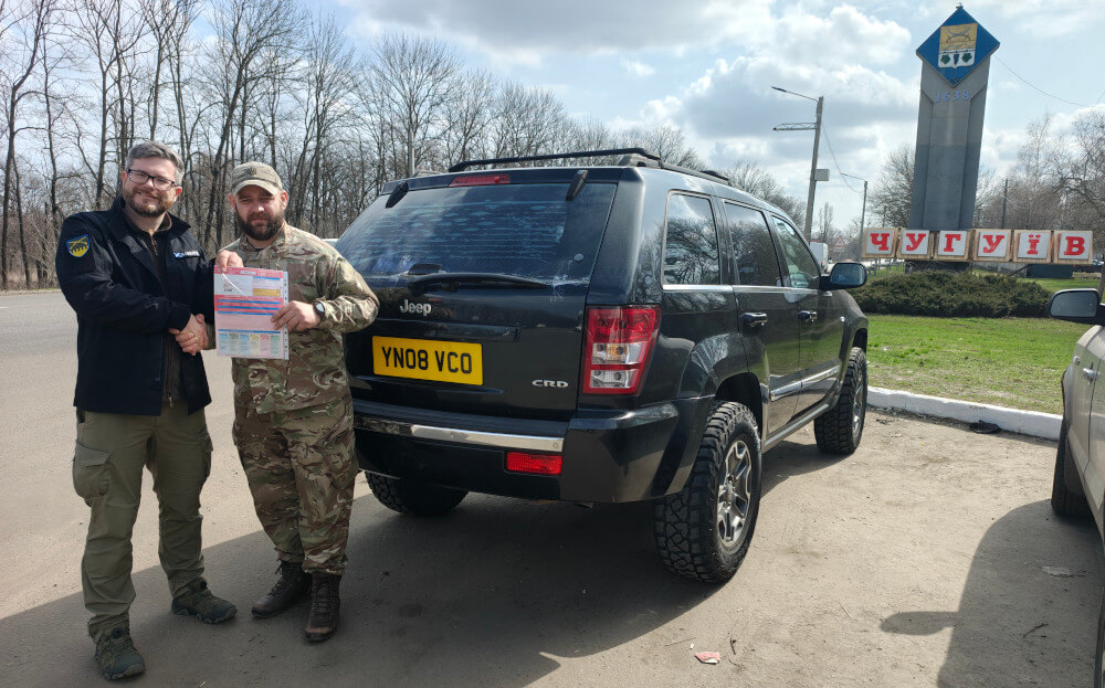 Oleg, the head of Sunflower Scotland transfers the Jeep and paperwork to the commander of 1st battalion of 113th Territorial Brigade