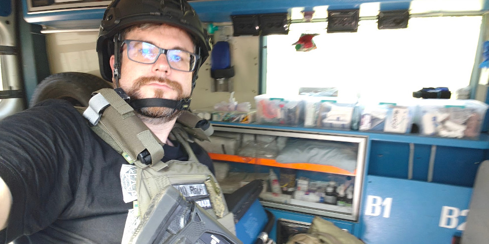 Oleg Dmitriev, Sunflower Scotland's chairman, with anti-drone shotgun in an ambulance