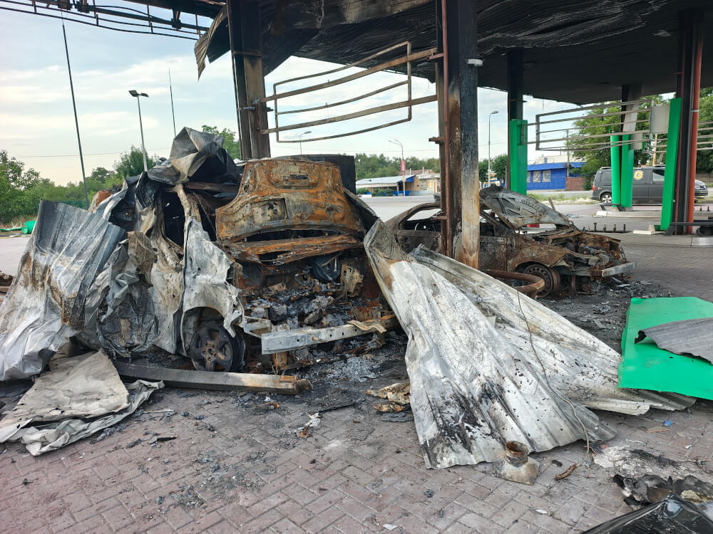 Burnt cars at destroyed WOG petrol station in Pavlohrad